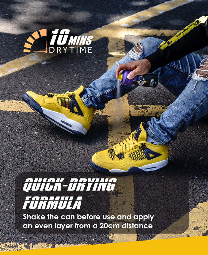 Person wearing yellow sneakers with a quick-drying formula advertisement on a road.